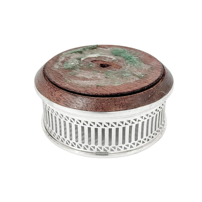Victorian style mahogany and sterling silver bottle coaster with pierced border