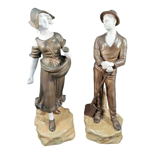 Pair of Art Nouveau Theodore Schoop for Bernard Bloch porcelain figurines, farming peasant couple