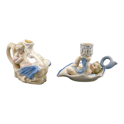 Georgian softpaste porcelain and creamware cherub candle chambersticks, putti on wyvern and leaf