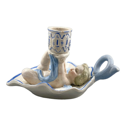 Georgian softpaste porcelain and creamware cherub candle chambersticks, putti on wyvern and leaf