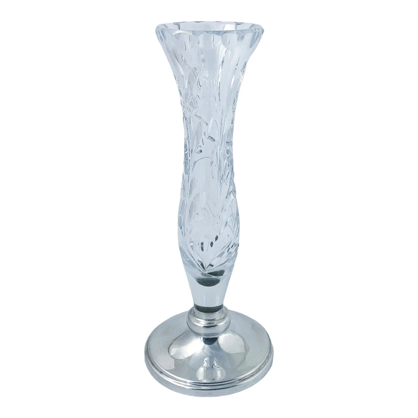 Vintage crystal flower vase resting on a sterling silver stepped round foot