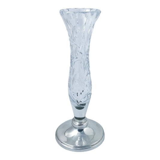 Vintage crystal flower vase resting on a sterling silver stepped round foot