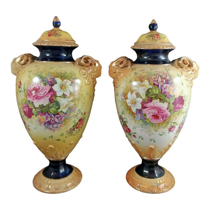 Pair of mid-19th Century KPM floral porcelain gilt lidded urns/vases in Neoclassical style