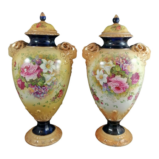 Pair of mid-19th Century KPM floral porcelain gilt lidded urns/vases in Neoclassical style