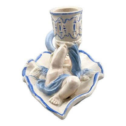 Georgian softpaste porcelain and creamware cherub candle chambersticks, putti on wyvern and leaf