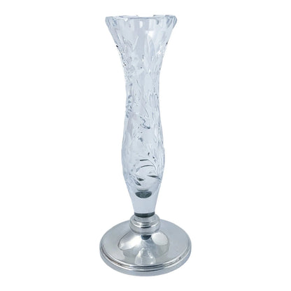Vintage crystal flower vase resting on a sterling silver stepped round foot