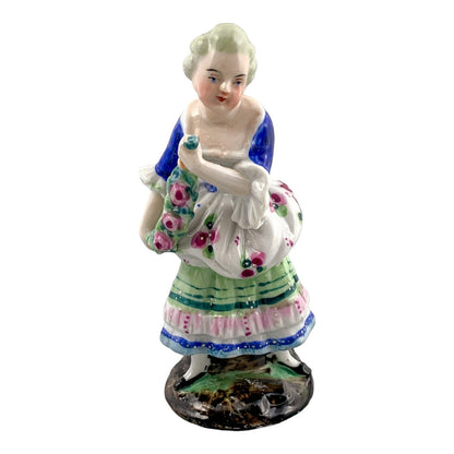19th century German porcelain matching figurines – Regency gentleman and lady with flower garland