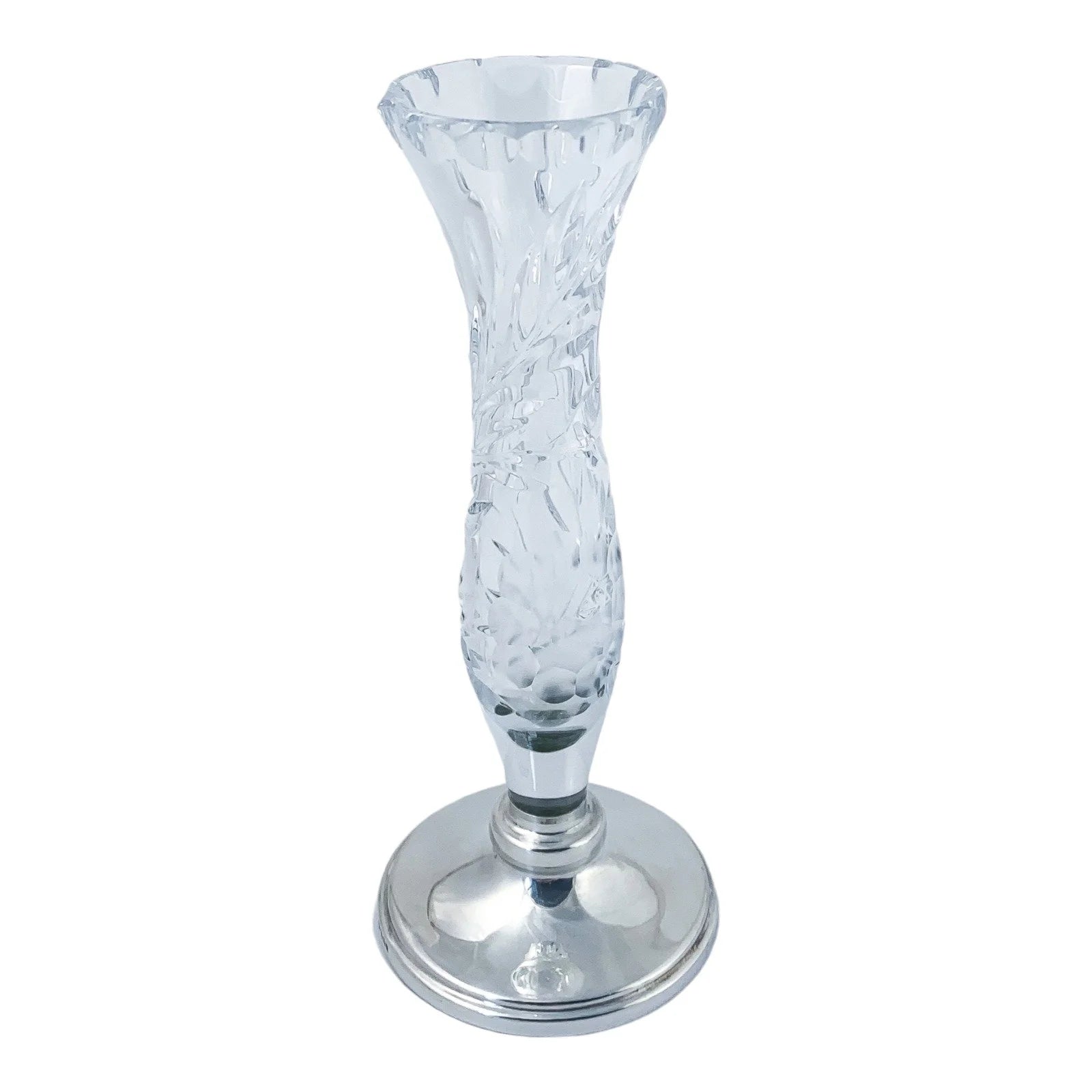 Vintage crystal flower vase resting on a sterling silver stepped round foot