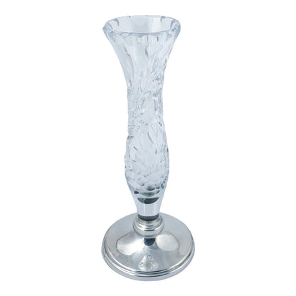 Vintage crystal flower vase resting on a sterling silver stepped round foot