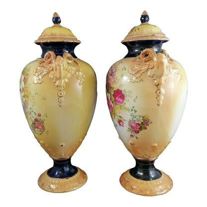 Pair of mid-19th Century KPM floral porcelain gilt lidded urns/vases in Neoclassical style
