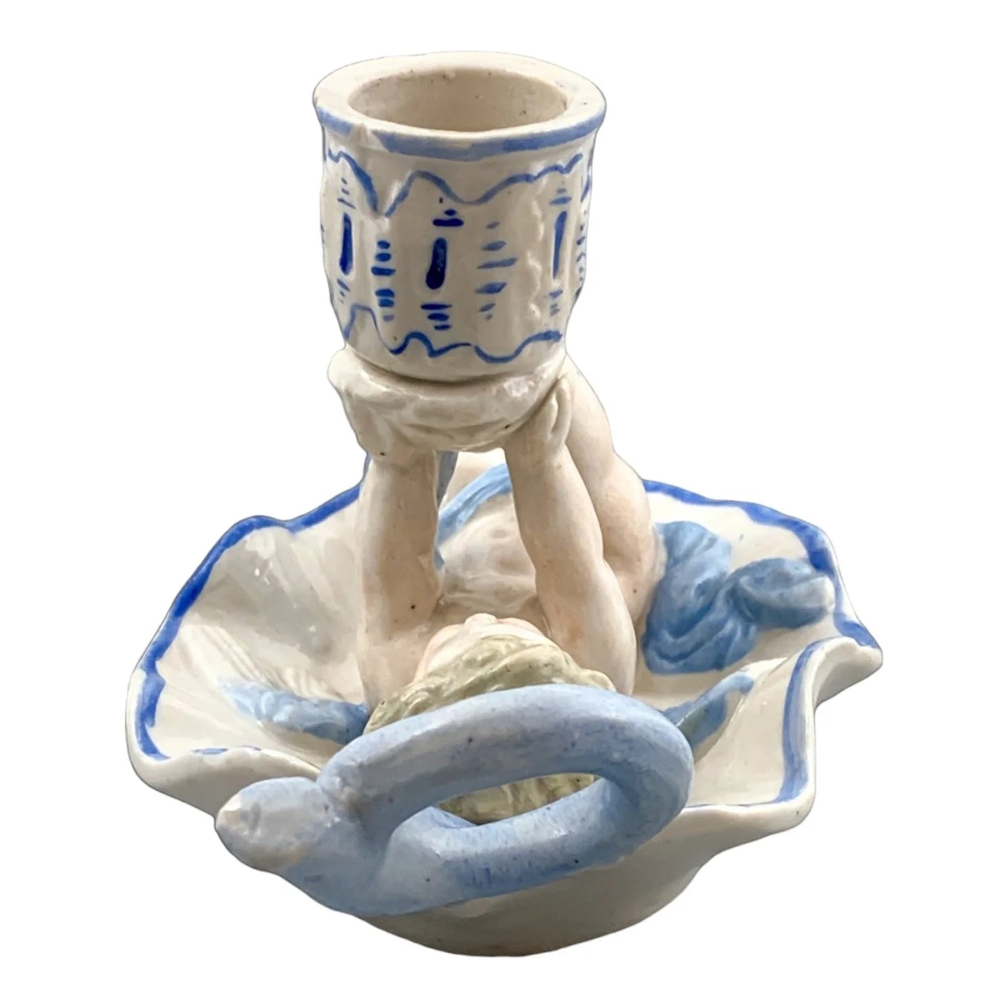 Georgian softpaste porcelain and creamware cherub candle chambersticks, putti on wyvern and leaf