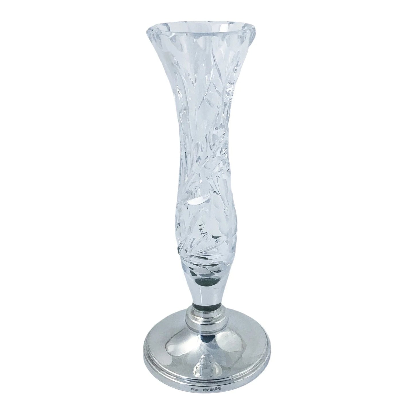 Vintage crystal flower vase resting on a sterling silver stepped round foot