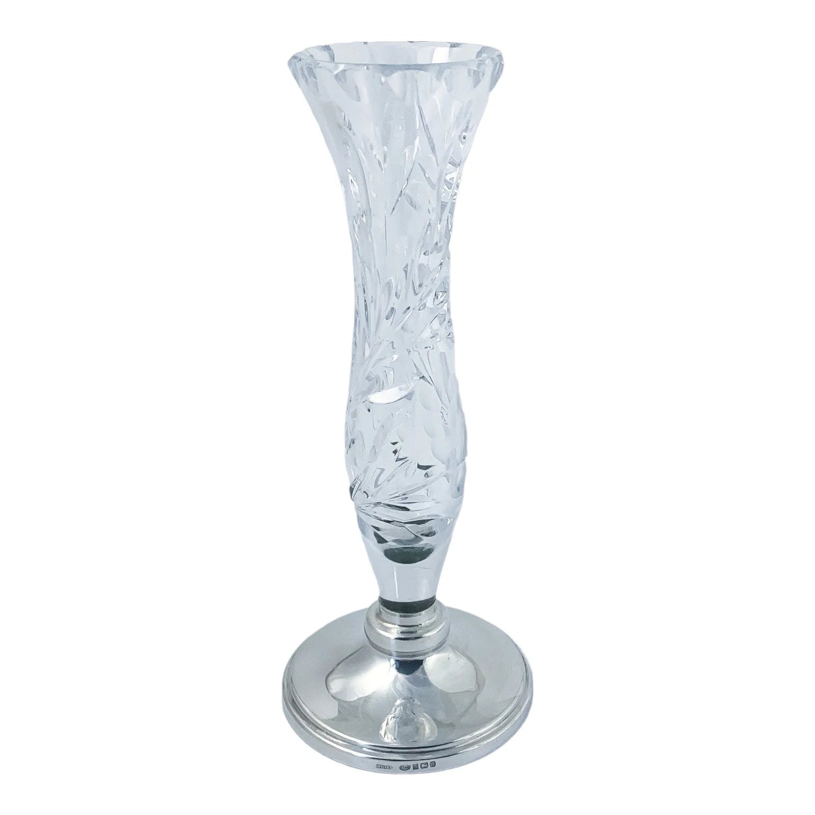 Vintage crystal flower vase resting on a sterling silver stepped round foot