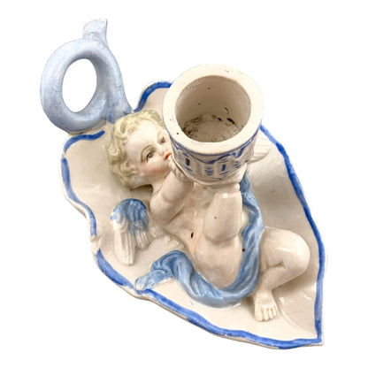 Georgian softpaste porcelain and creamware cherub candle chambersticks, putti on wyvern and leaf