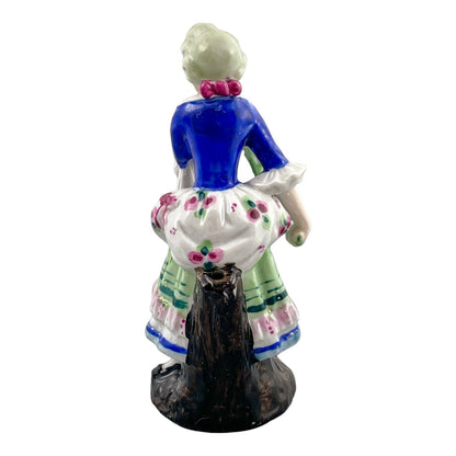 19th century German porcelain matching figurines – Regency gentleman and lady with flower garland