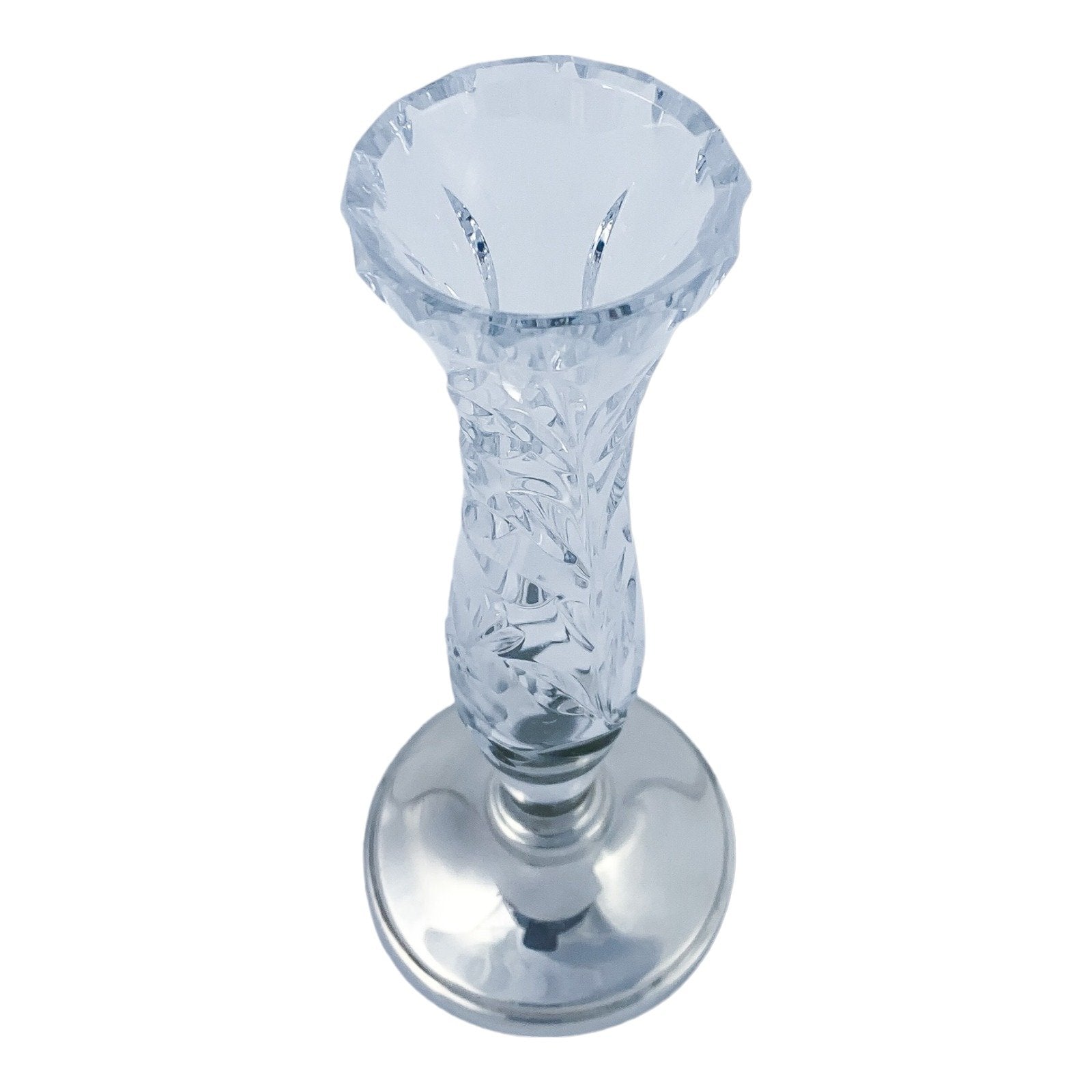Vintage crystal flower vase resting on a sterling silver stepped round foot