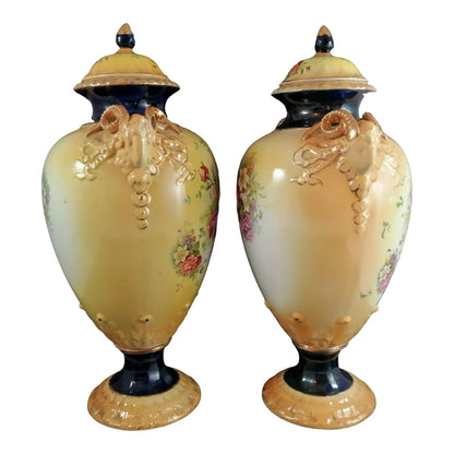 Pair of mid-19th Century KPM floral porcelain gilt lidded urns/vases in Neoclassical style