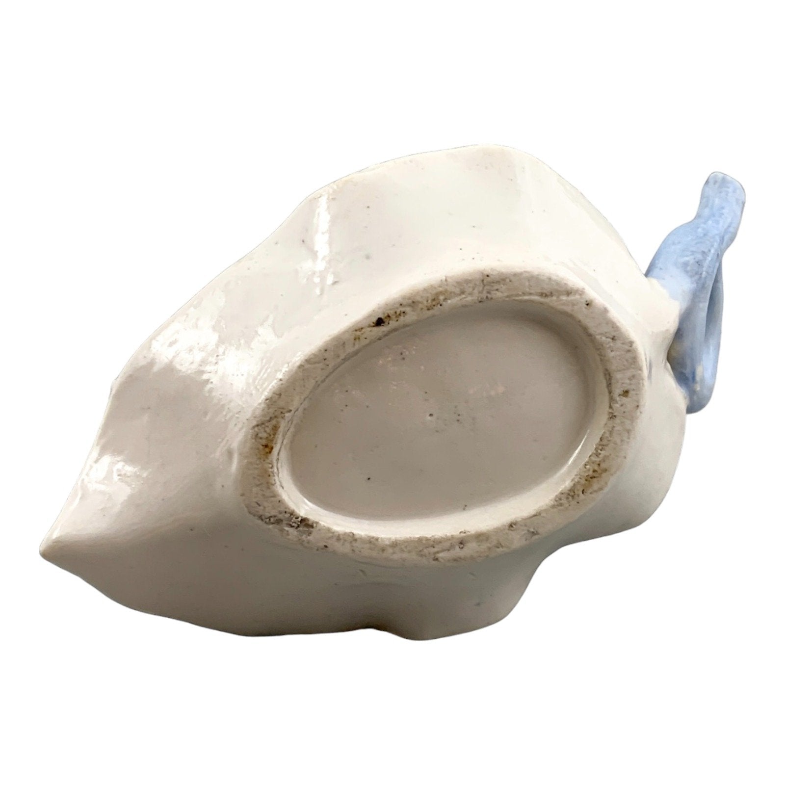 Georgian softpaste porcelain and creamware cherub candle chambersticks, putti on wyvern and leaf