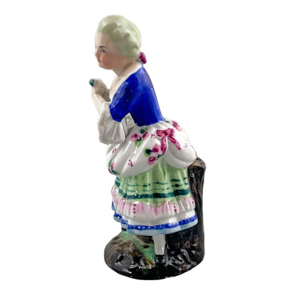 19th century German porcelain matching figurines – Regency gentleman and lady with flower garland