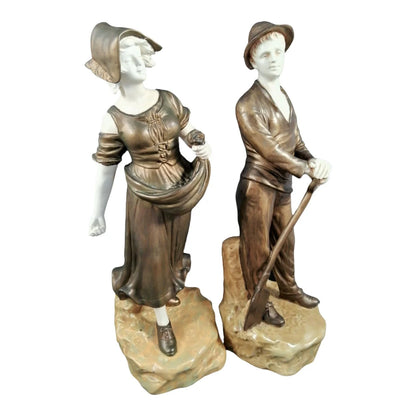 Pair of Art Nouveau Theodore Schoop for Bernard Bloch porcelain figurines, farming peasant couple