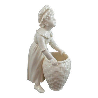 Victorian Royal Worcester "Kate Greenaway" porcelain figurine of young girl with basket modelled by James Hadley