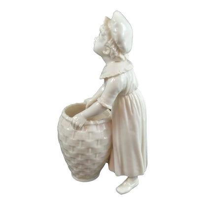 Victorian Royal Worcester "Kate Greenaway" porcelain figurine of young girl with basket modelled by James Hadley