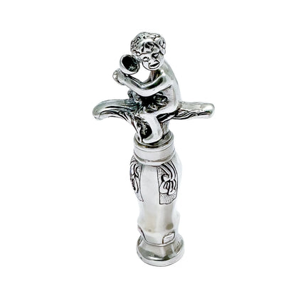 Large Dutch solid silver figural corkscrew of Bacchus / Cupid drinking wine
