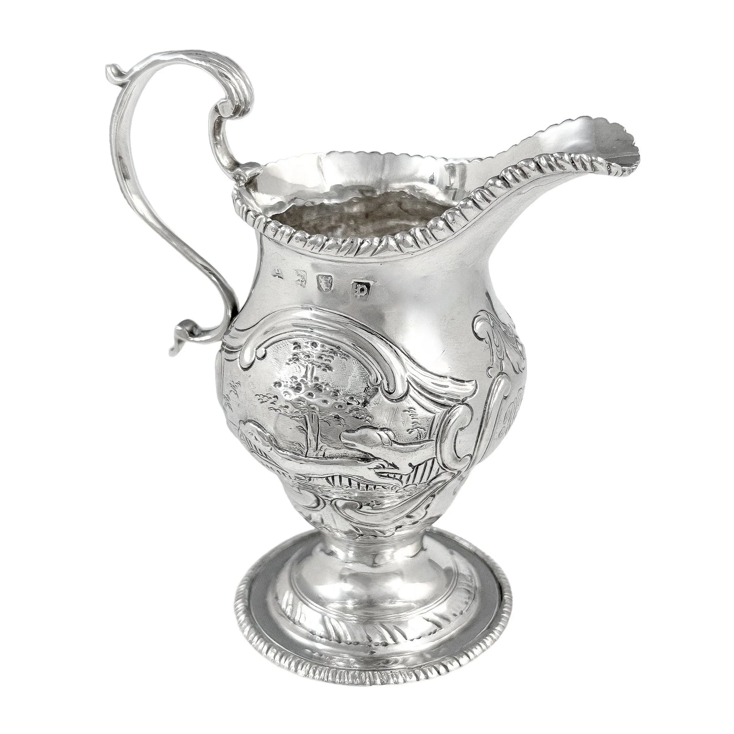 George III sterling milk jug on pedestal foot with hunting scenes, Walter Brind, 1770