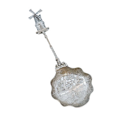 19th century Dutch silver tea strainer spoon with pastoral scene and windmill finial