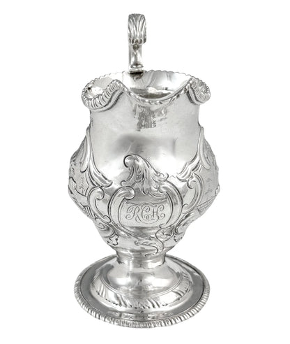 George III sterling milk jug on pedestal foot with hunting scenes, Walter Brind, 1770