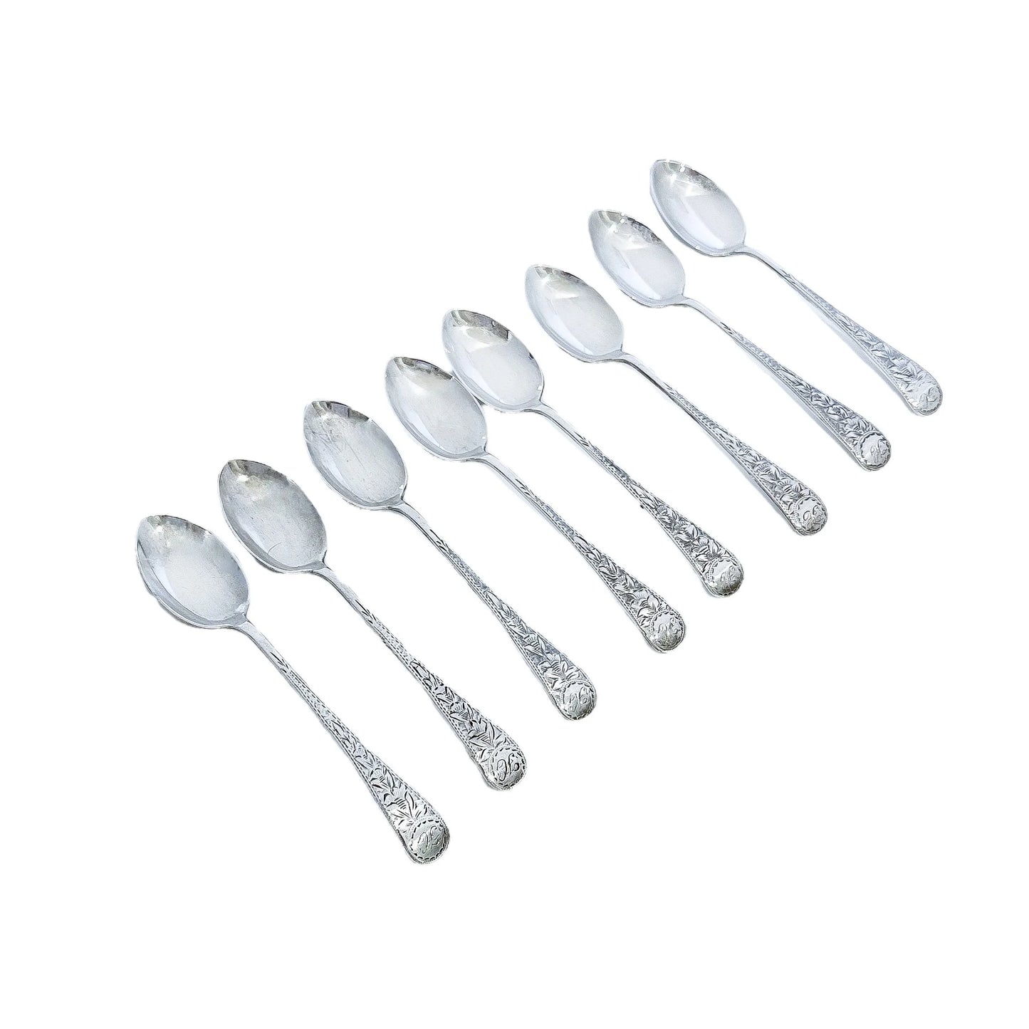 George V cased set of 8 sterling silver tea or coffee spoons, bright cut with flowers