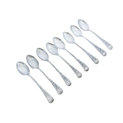 George V cased set of 8 sterling silver tea or coffee spoons, bright cut with flowers