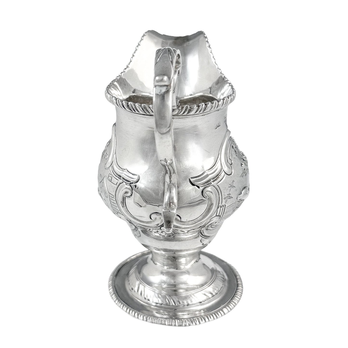 George III sterling milk jug on pedestal foot with hunting scenes, Walter Brind, 1770