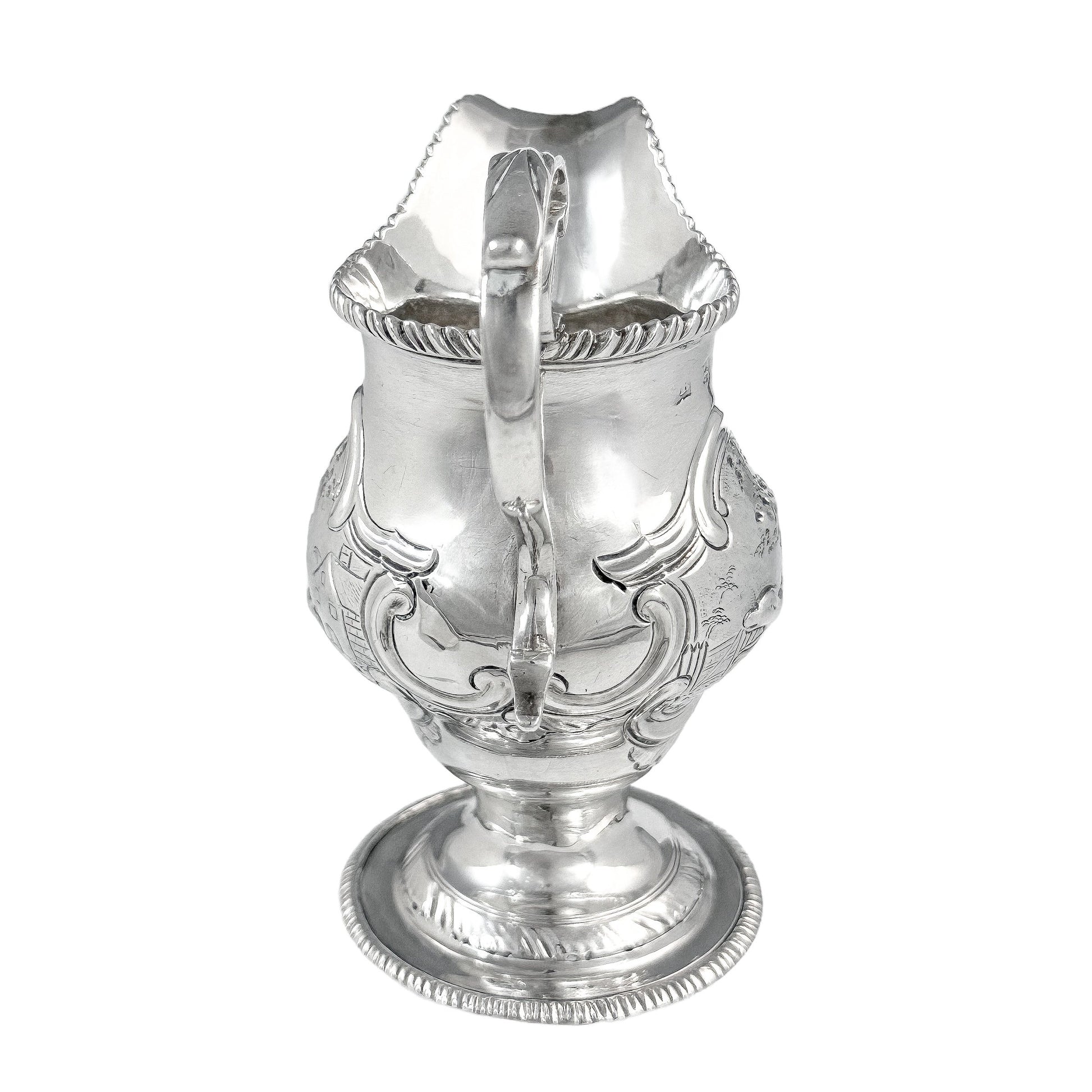 George III sterling milk jug on pedestal foot with hunting scenes, Walter Brind, 1770