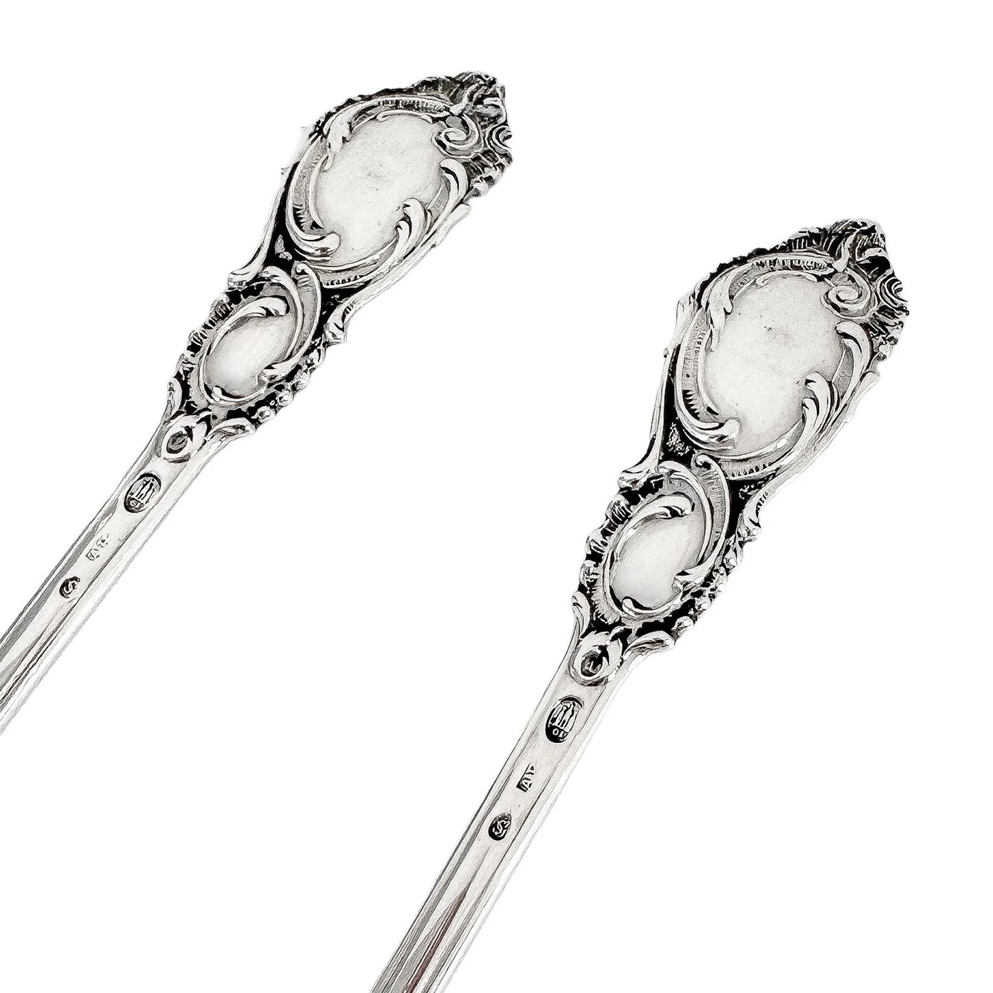 Danish solid silver pair dessert spoons with rich foliate design