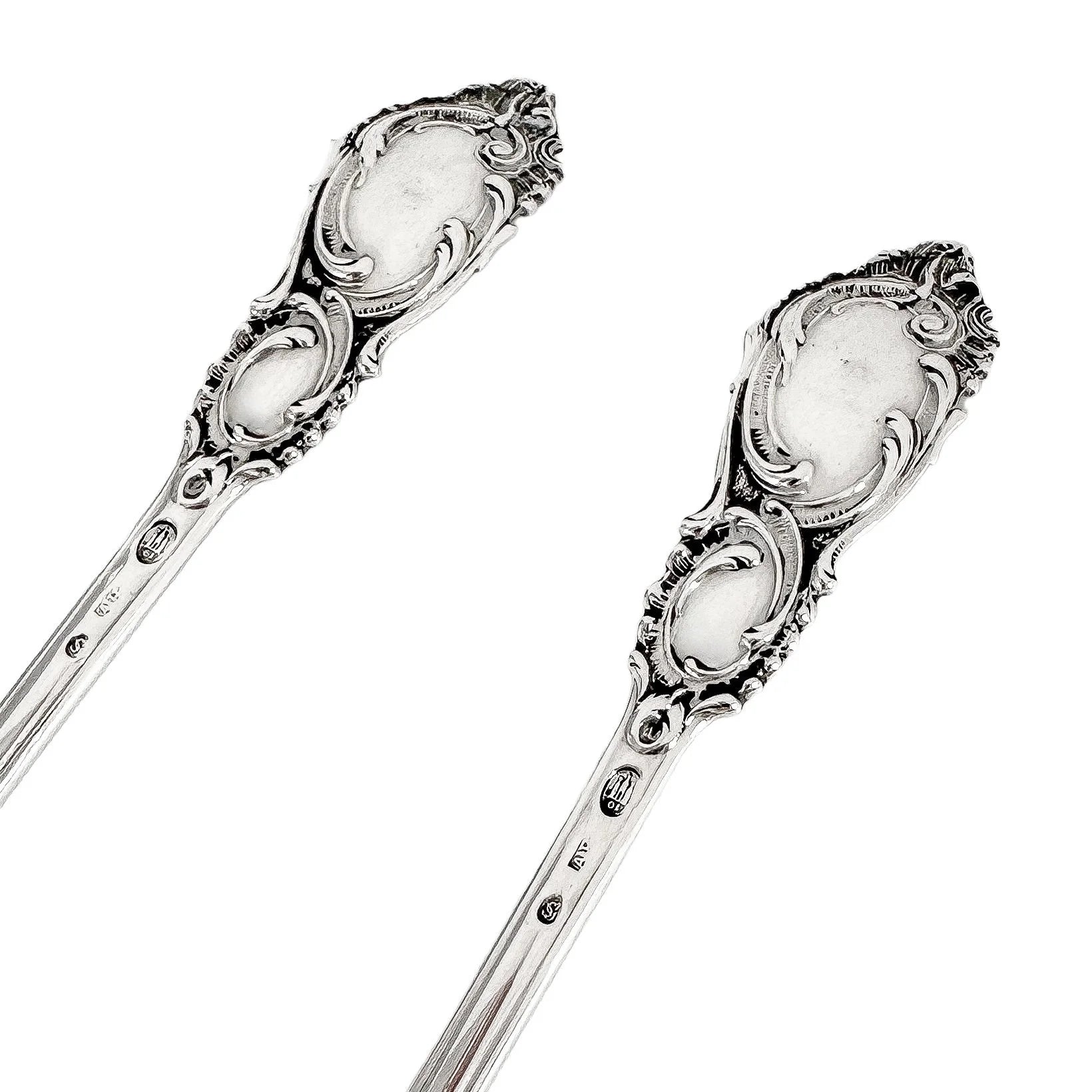 Danish solid silver pair dessert spoons with rich foliate design