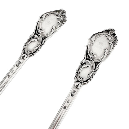 Danish solid silver pair dessert spoons with rich foliate design
