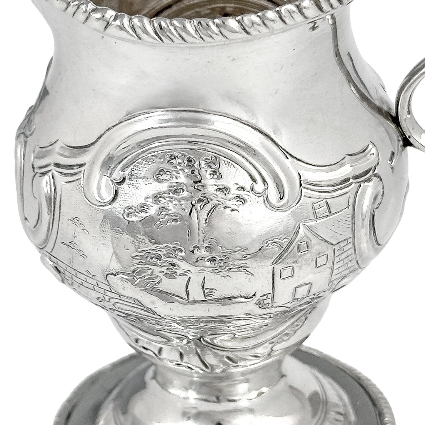 George III sterling milk jug on pedestal foot with hunting scenes, Walter Brind, 1770
