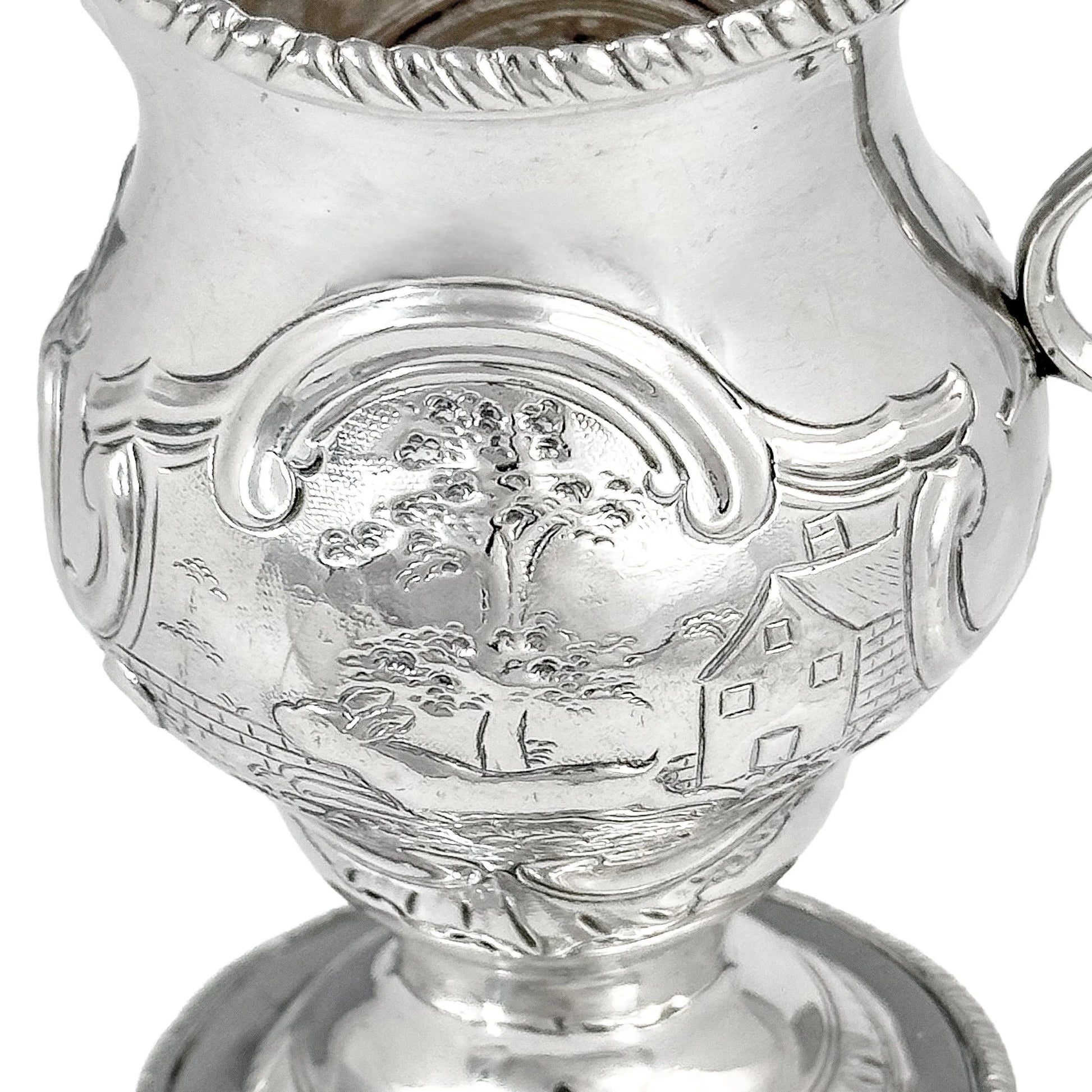 George III sterling milk jug on pedestal foot with hunting scenes, Walter Brind, 1770