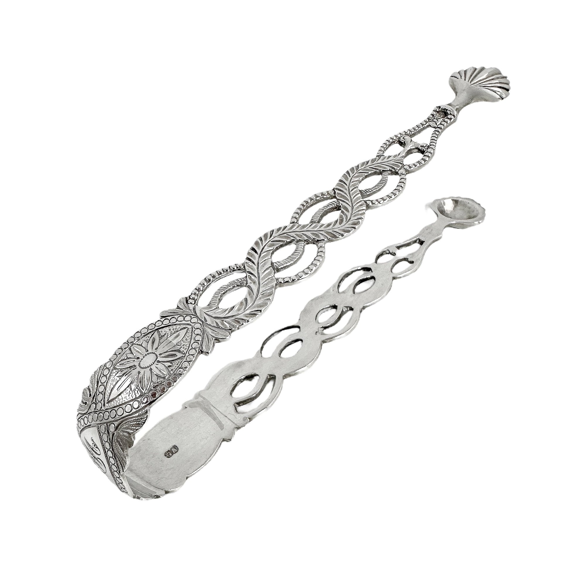 Large Victorian sterling silver sugar tongs with pierced ropework arms and shell terminals