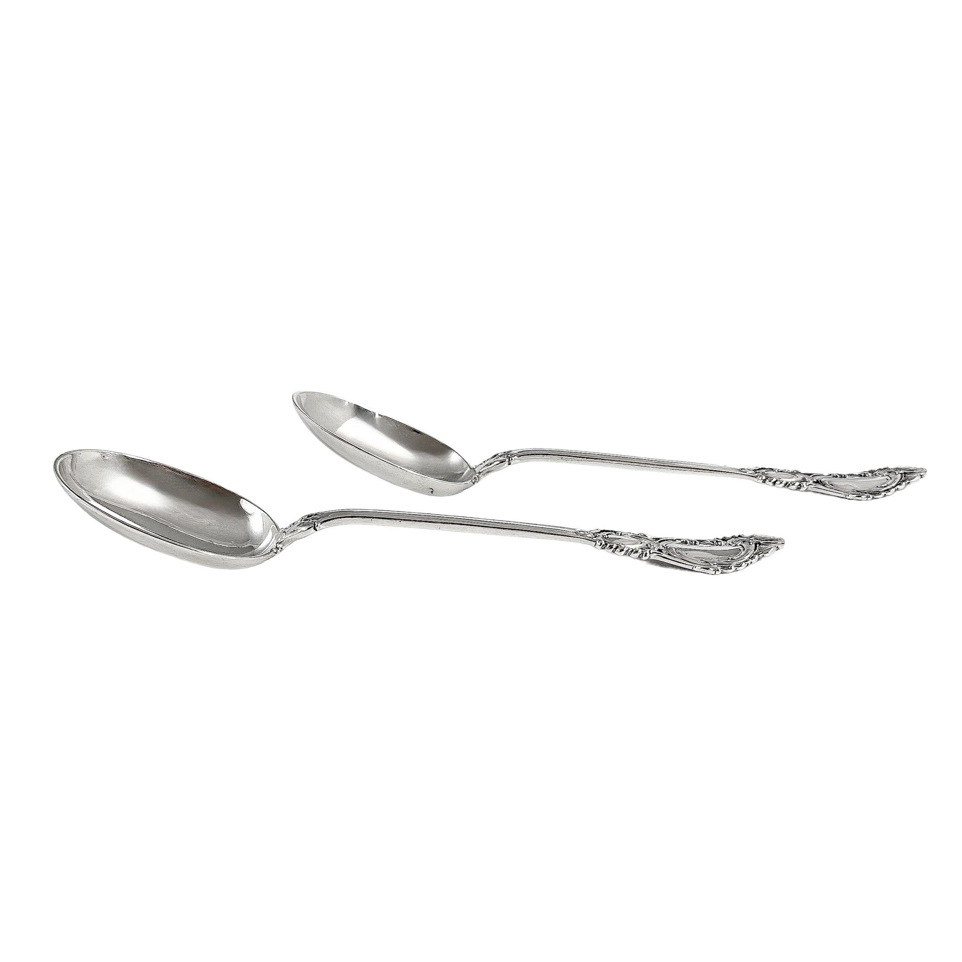Danish solid silver pair dessert spoons with rich foliate design