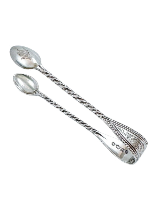 Early Victorian sterling silver sugar tongs with twisted arms and foliate engraving