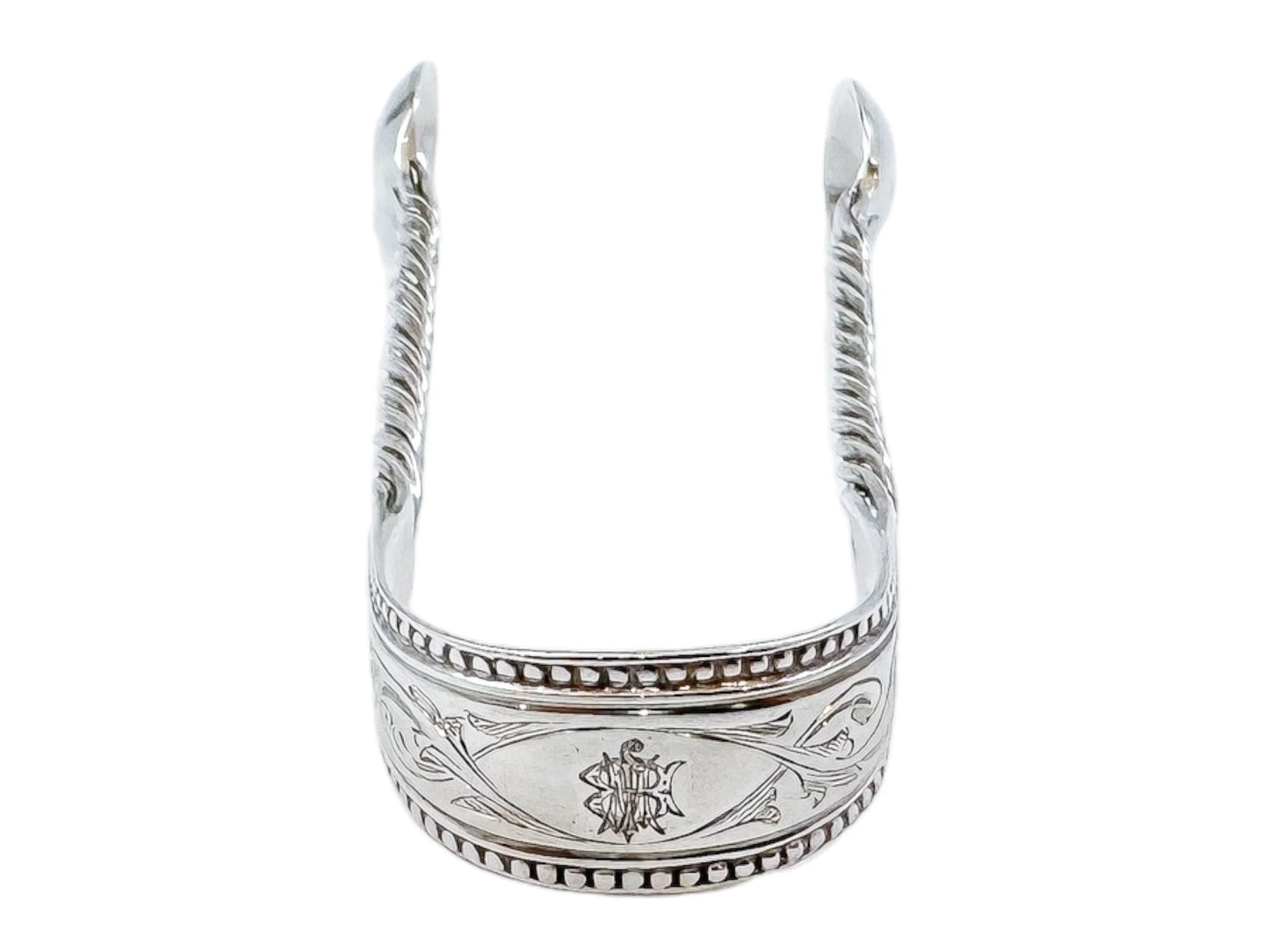 Early Victorian sterling silver sugar tongs with twisted arms and foliate engraving