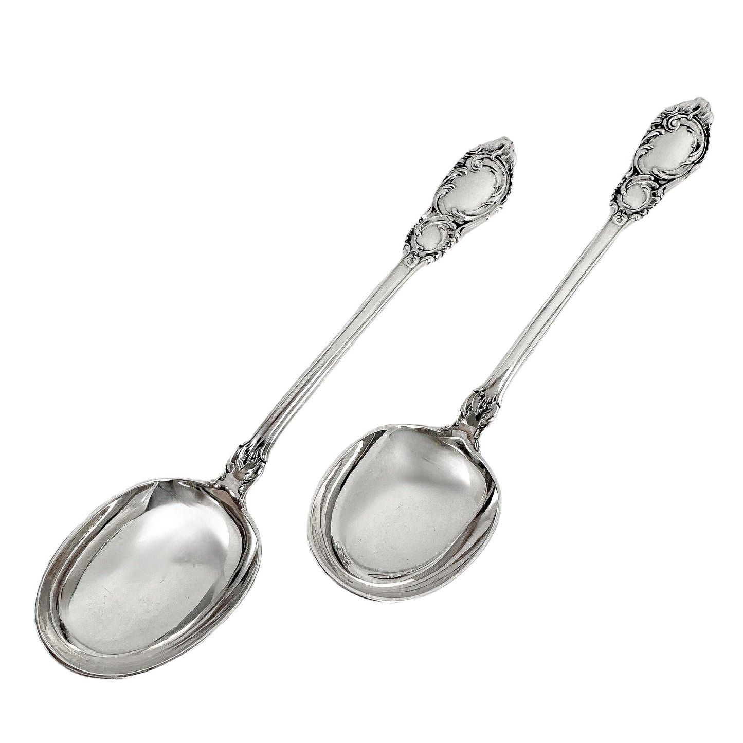Danish solid silver pair dessert spoons with rich foliate design