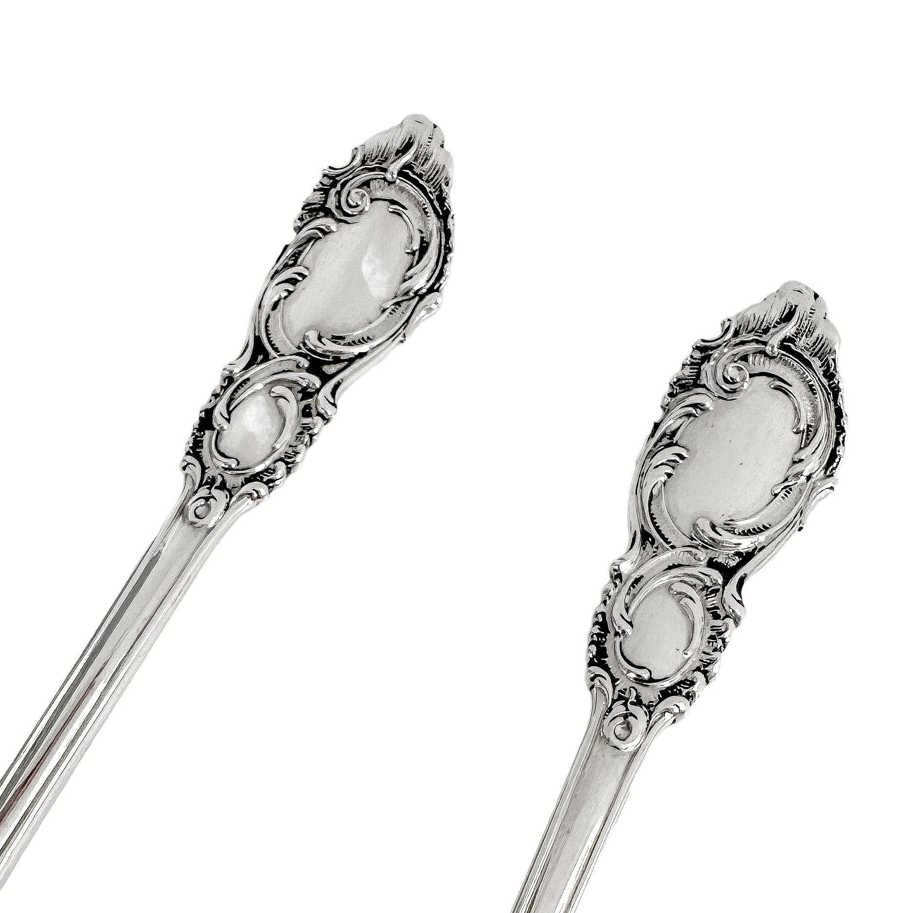 Danish solid silver pair dessert spoons with rich foliate design
