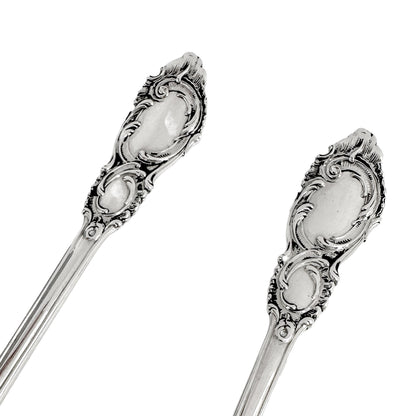 Danish solid silver pair dessert spoons with rich foliate design