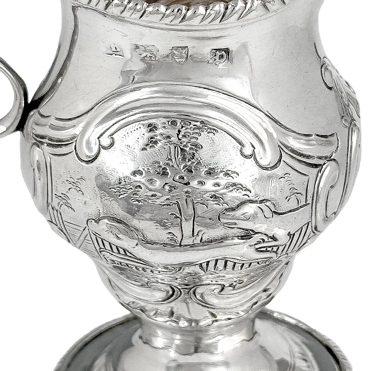 George III sterling milk jug on pedestal foot with hunting scenes, Walter Brind, 1770