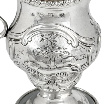 George III sterling milk jug on pedestal foot with hunting scenes, Walter Brind, 1770