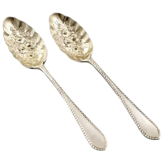 Pair of Victorian gilt silver plated dessert berry spoons with frilled edges