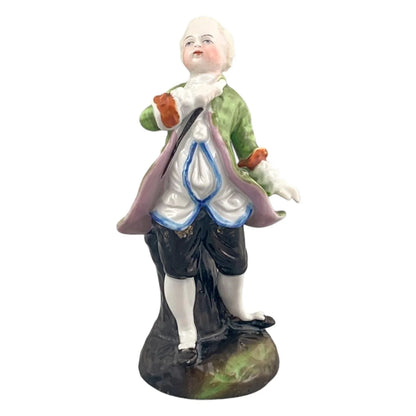 19th century German porcelain matching figurines – Regency gentleman and lady with flower garland